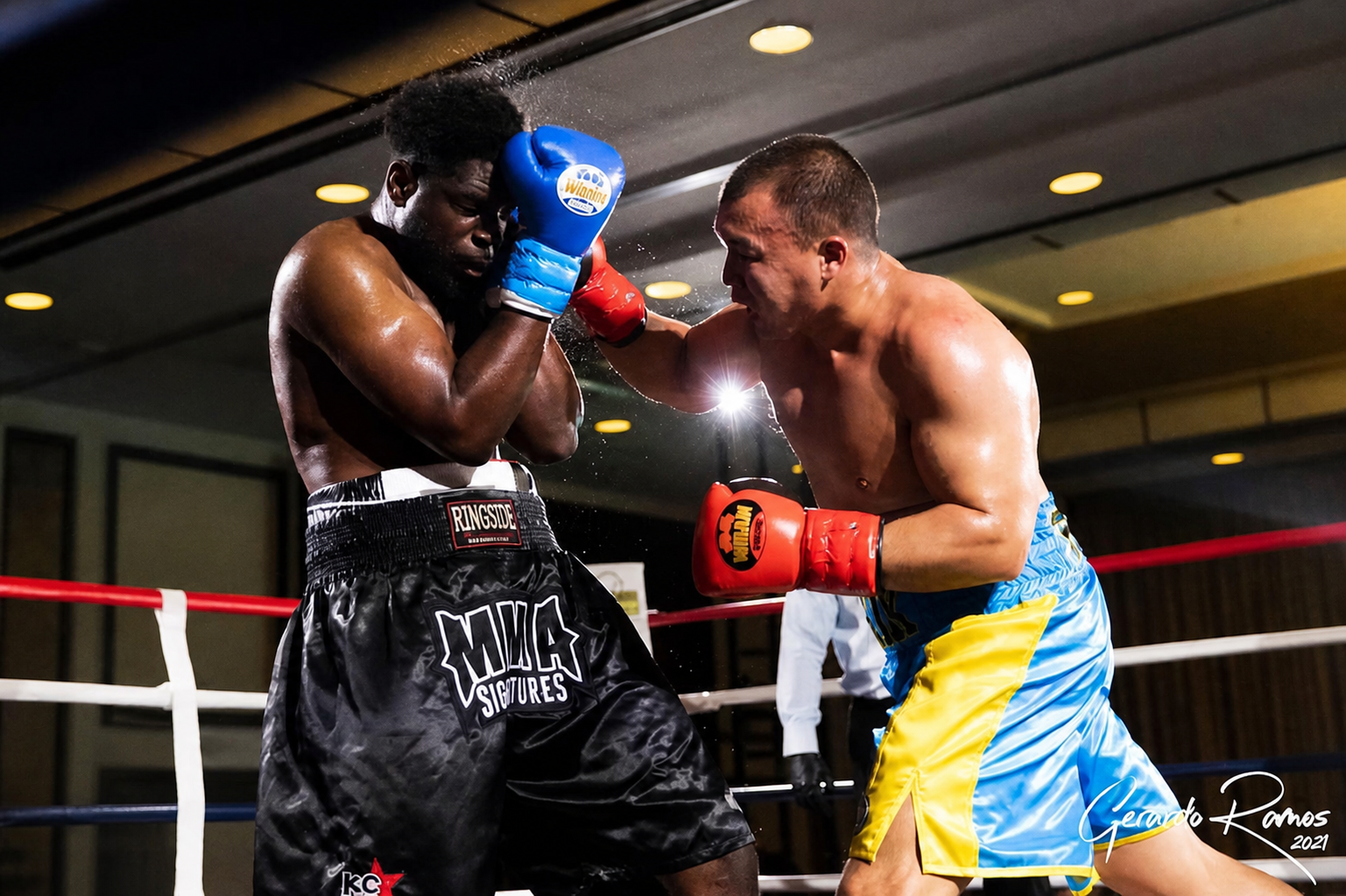 Serik Musadilov working an opponent against the ropes